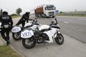 Užrašas VKTI ant motociklų byloja, kad kiekviena sunkiasvorė transporto priemonė gali būti bet kada sustabdyta ir nukreipta patikrinti.