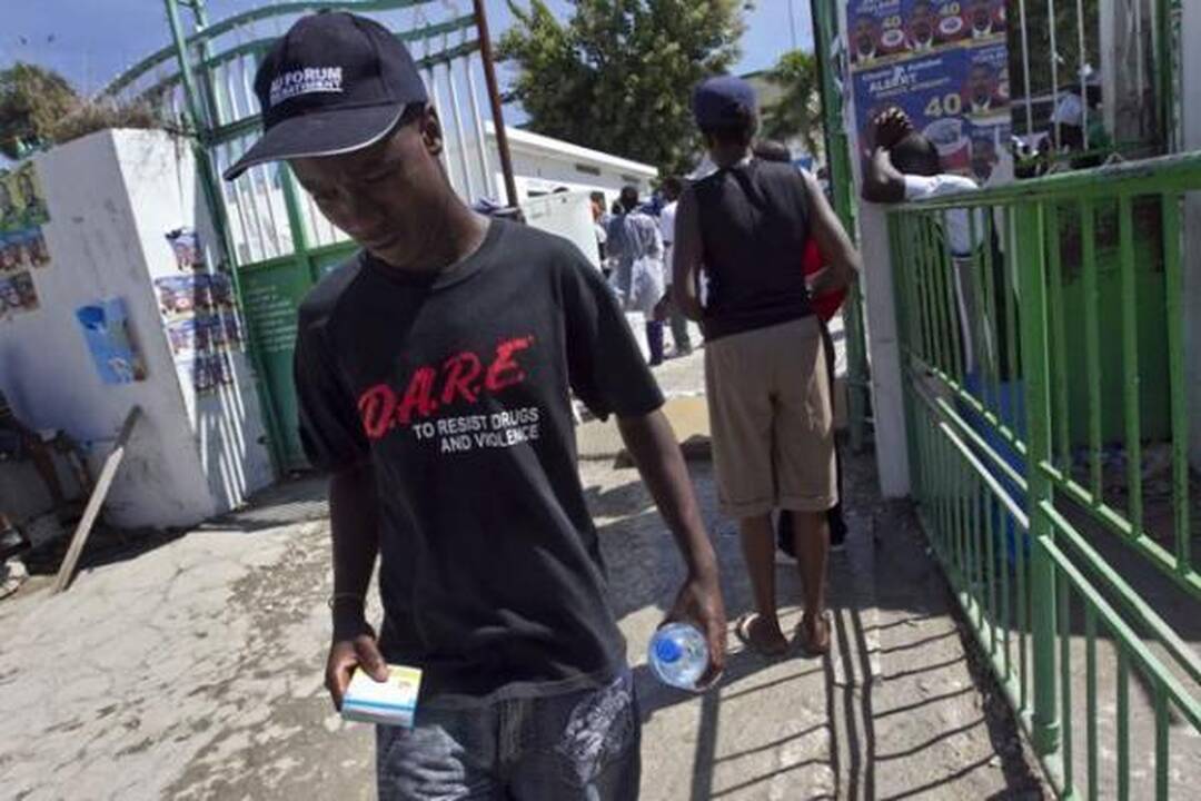 Choleros gniaužtuose atsidūrusius haitiečius kausto baimė ir kančia