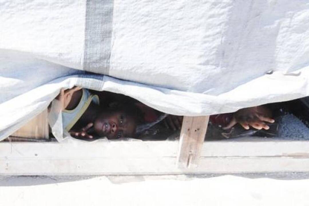 Choleros gniaužtuose atsidūrusius haitiečius kausto baimė ir kančia