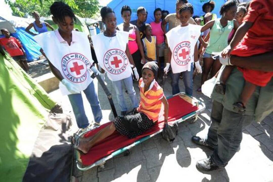 Choleros gniaužtuose atsidūrusius haitiečius kausto baimė ir kančia