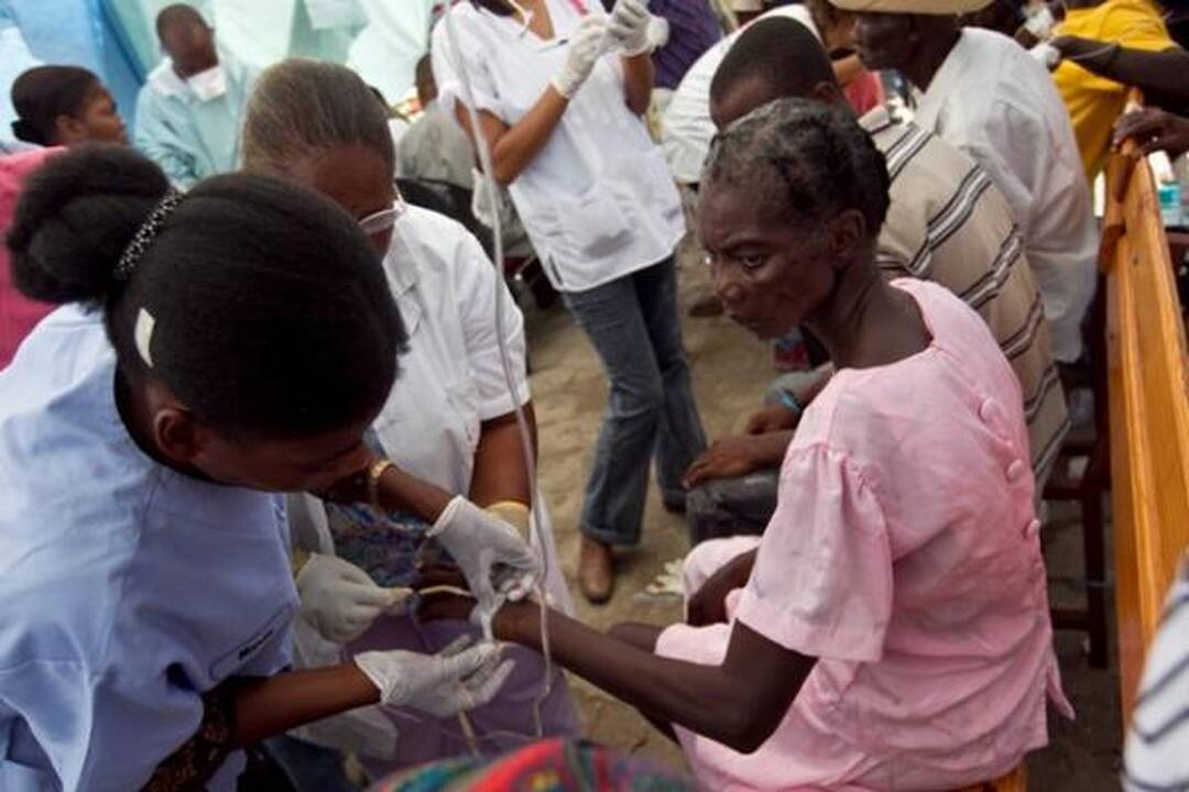 Choleros gniaužtuose atsidūrusius haitiečius kausto baimė ir kančia