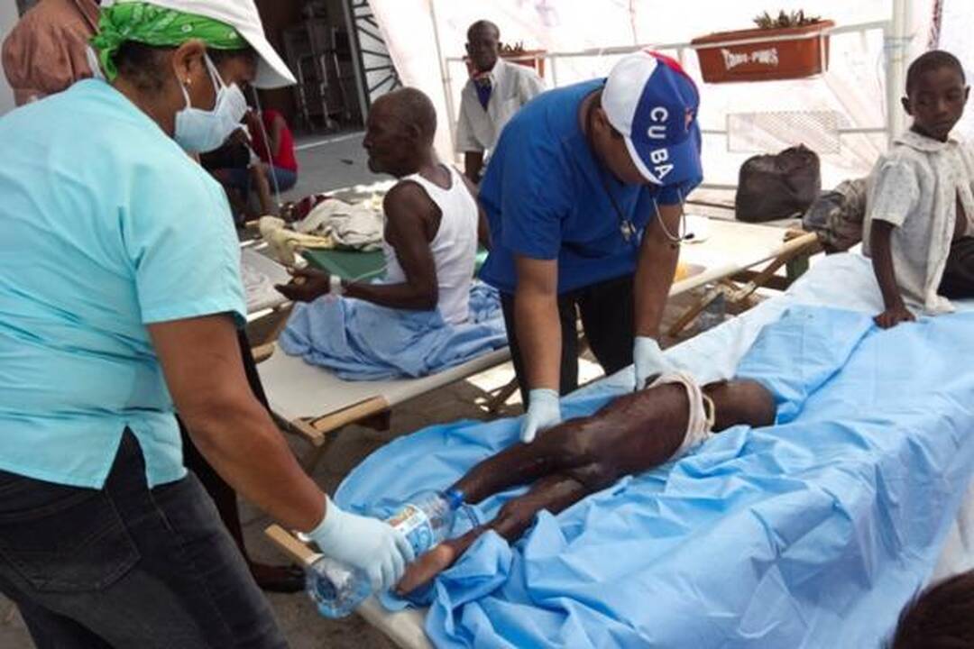 Choleros gniaužtuose atsidūrusius haitiečius kausto baimė ir kančia