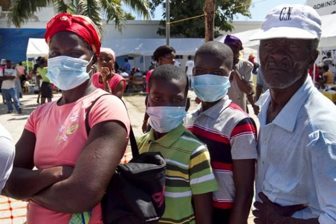 Choleros gniaužtuose atsidūrusius haitiečius kausto baimė ir kančia