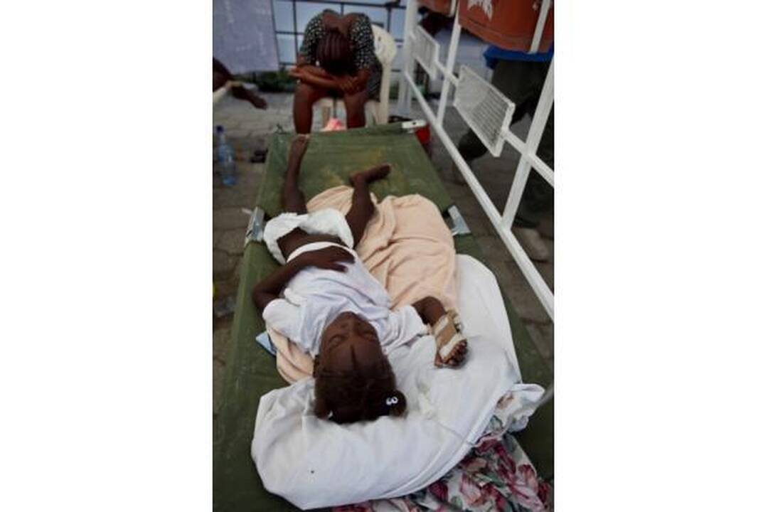Choleros gniaužtuose atsidūrusius haitiečius kausto baimė ir kančia