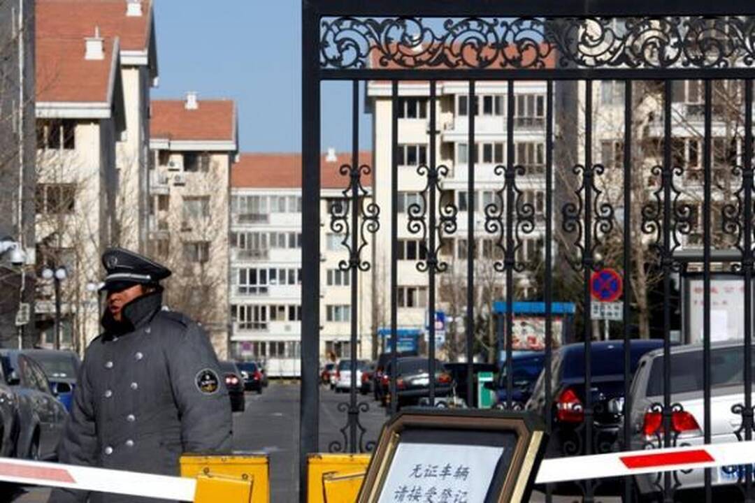 Prieš Nobelio ceremoniją priešais JT biurą Pekine surengtas protestas