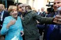 Anasas Modamani ir Angela Merkel