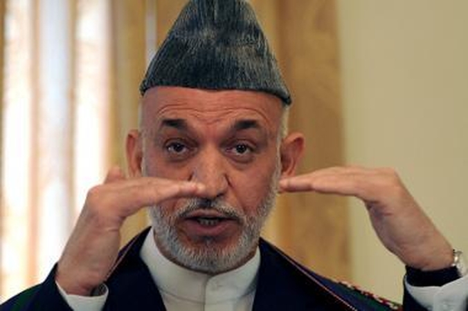 Afganistano prezidentas Karzai pripažino gaudavęs "krepšius pinigų" iš Irano