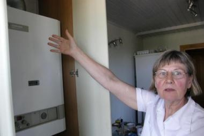 Painiava: dvylika metų I.Gudelionienė vargsta dėl dujinio katilo įteisinimo, nors kiti kaimynai butus šildo dujomis.
