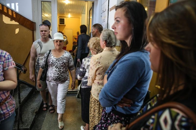 Dėl naujų pasų – pasistumdymai ilgose eilėse